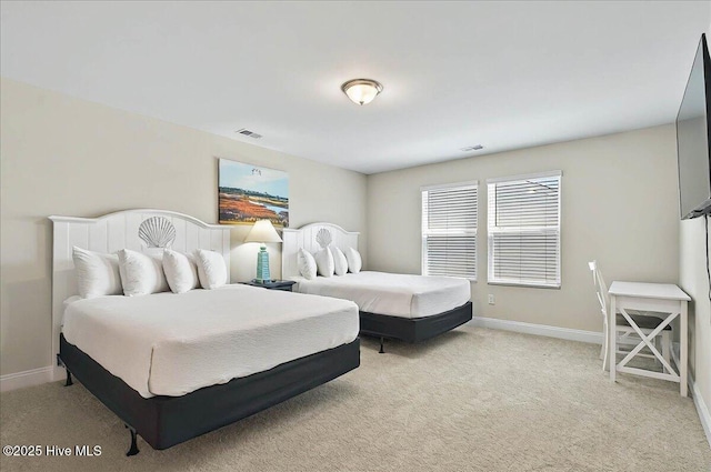 bedroom with light carpet, baseboards, and visible vents