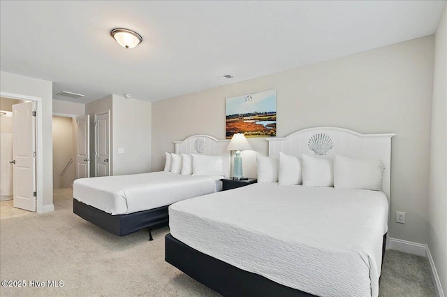 bedroom featuring light colored carpet, baseboards, and visible vents