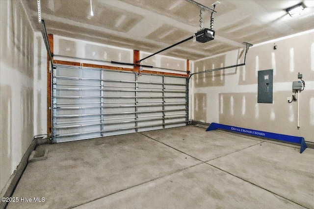 garage featuring electric panel and a garage door opener