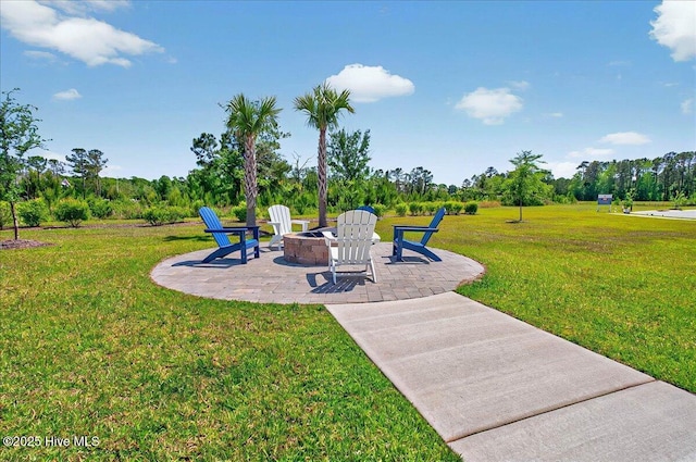 exterior space featuring a patio area and a fire pit