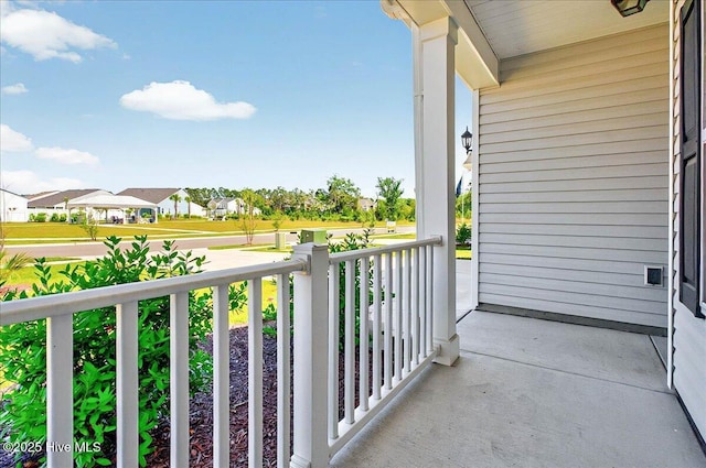 balcony with a porch and a residential view
