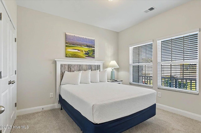 bedroom with carpet, baseboards, and visible vents