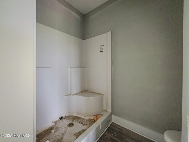 706 N New River Dr, Surf City, NC 28445 - full bathroom with a shower, baseboards, toilet, and wood finished floors