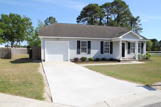 ranch-style home featuring driveway, roof with shingles, a front yard, fence, and an attached garage