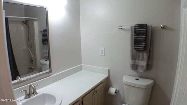 bathroom with vanity, shower / bath combo with shower curtain, and toilet