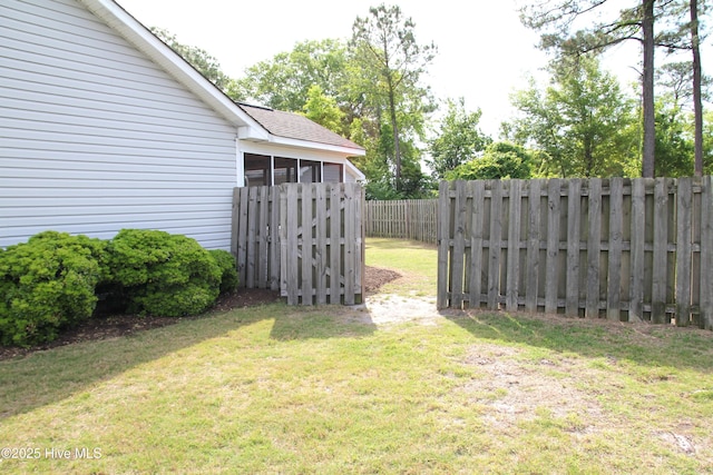 view of yard with a fenced backyard