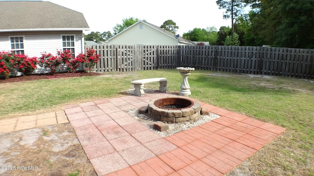 view of patio / terrace featuring a fenced backyard and an outdoor fire pit