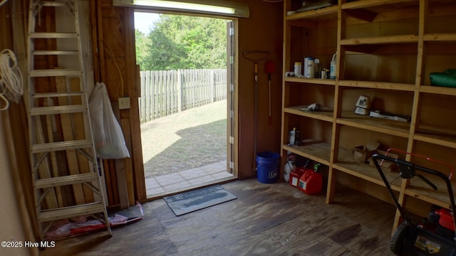doorway to outside with dark wood-style flooring