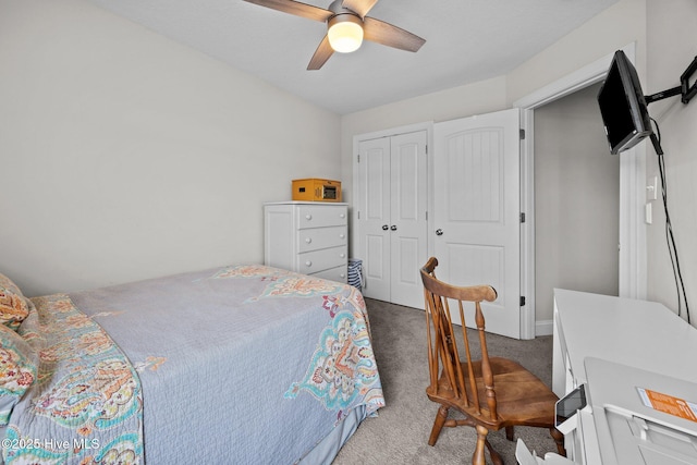 bedroom featuring ceiling fan, carpet, and a closet