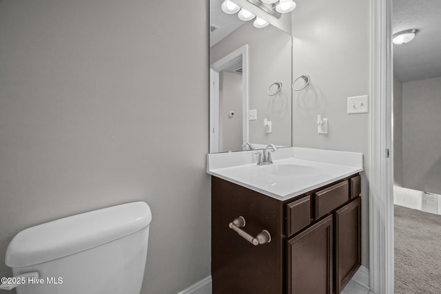 half bath with vanity and toilet