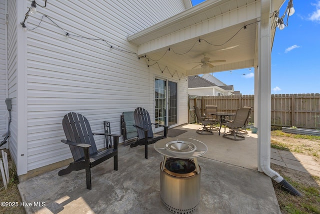 view of patio / terrace featuring ceiling fan, fence, and outdoor dining area