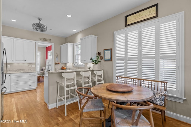 423 Black Diamond Dr, Wilmington, NC 28411 - dining room featuring baseboards, light wood finished floors, and recessed lighting