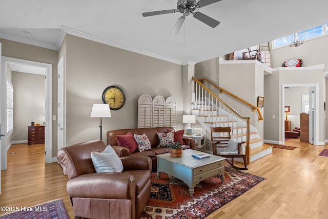 423 Black Diamond Dr, Wilmington, NC 28411 - living area with crown molding, wood finished floors, baseboards, and a healthy amount of sunlight