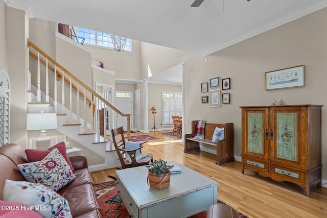 423 Black Diamond Dr, Wilmington, NC 28411 - living room with baseboards, stairway, crown molding, ceiling fan, and wood finished floors