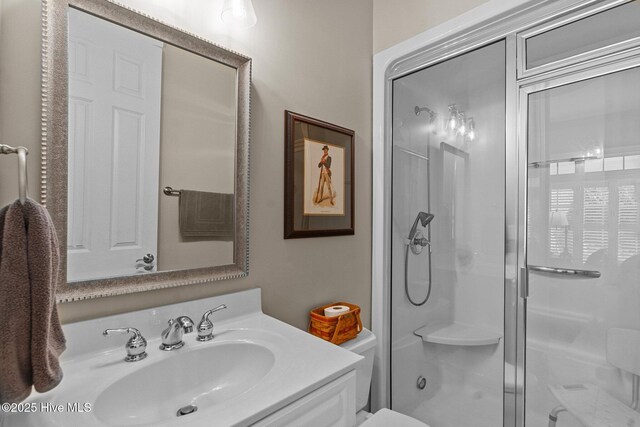 423 Black Diamond Dr, Wilmington, NC 28411 - bathroom featuring toilet, a stall shower, and vanity
