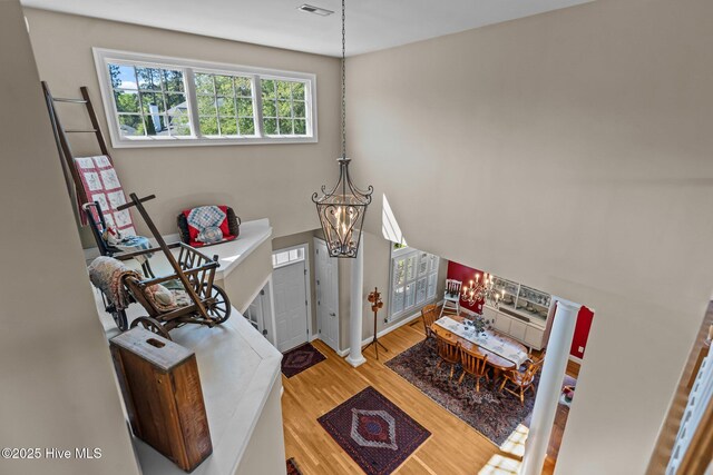 423 Black Diamond Dr, Wilmington, NC 28411 - interior space featuring visible vents, an inviting chandelier, and wood finished floors