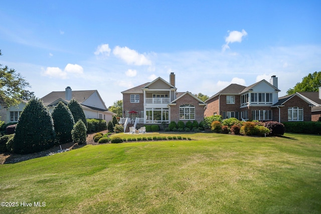 423 Black Diamond Dr, Wilmington, NC 28411 - view of front of house with a front yard and brick siding