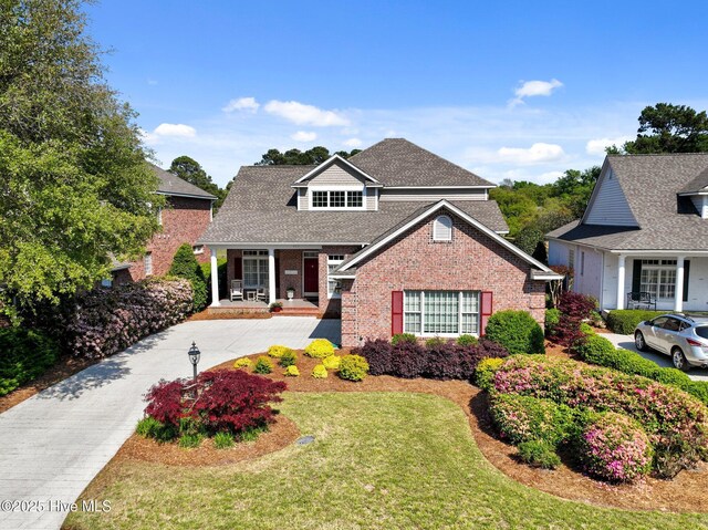 423 Black Diamond Dr, Wilmington, NC 28411 - view of front of property featuring roof with shingles, a front yard, and brick siding