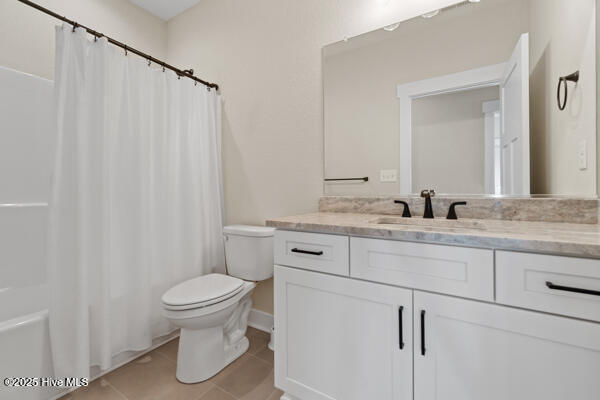 119 Bridgetowne Ave, Edenton, NC 27932 - bathroom with a shower with shower curtain, tile patterned floors, vanity, and toilet