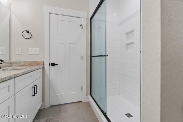 119 Bridgetowne Ave, Edenton, NC 27932 - bathroom featuring vanity, a stall shower, and tile patterned flooring