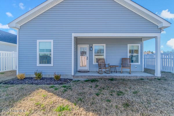 119 Bridgetowne Ave, Edenton, NC 27932 - back of house with covered porch, fence, and a lawn