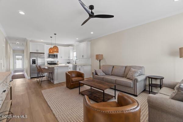 119 Bridgetowne Ave, Edenton, NC 27932 - living room with light wood-type flooring, a ceiling fan, and recessed lighting