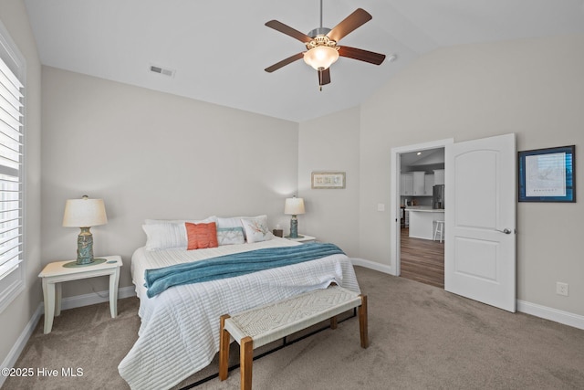 carpeted bedroom with stainless steel fridge with ice dispenser, visible vents, baseboards, and lofted ceiling