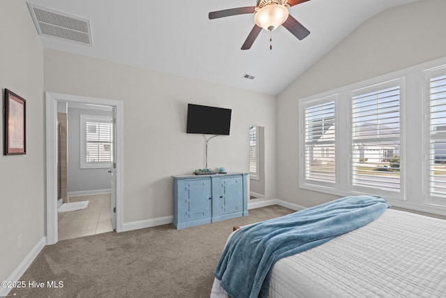 bedroom with visible vents, baseboards, light colored carpet, and lofted ceiling