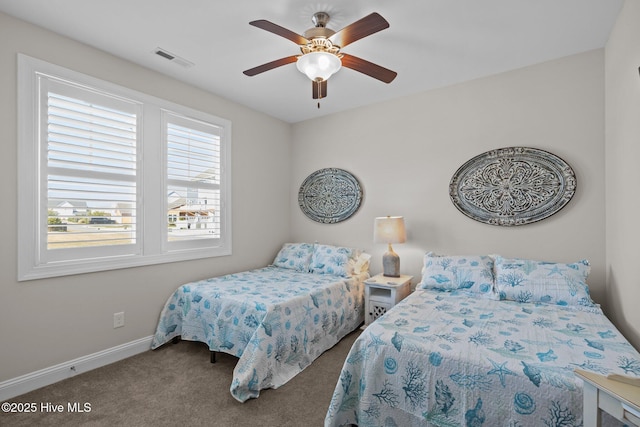 bedroom with visible vents, baseboards, a ceiling fan, and carpet flooring