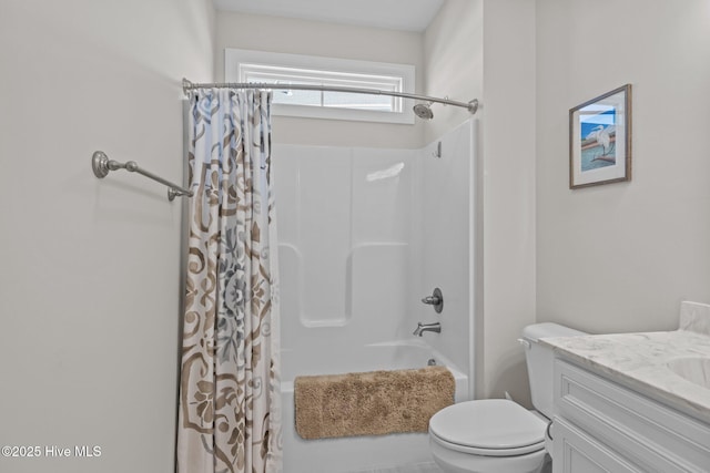 full bathroom with toilet, vanity, and shower / tub combo with curtain