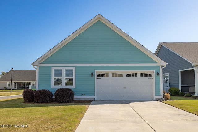 view of front of house featuring an attached garage, a front lawn, and concrete driveway