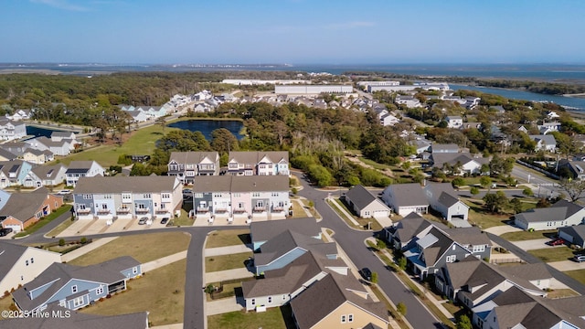 birds eye view of property featuring a residential view and a water view