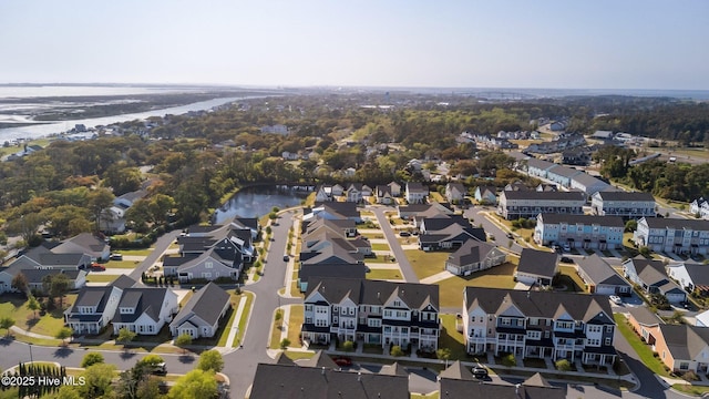 birds eye view of property featuring a water view and a residential view