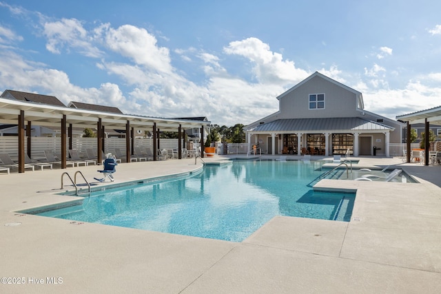 pool featuring fence and a patio