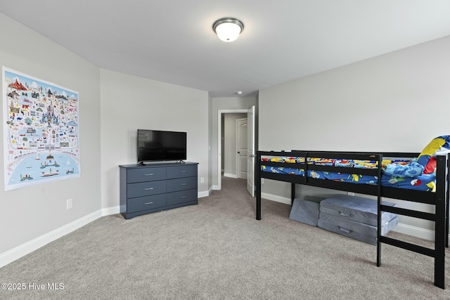 bedroom featuring carpet flooring and baseboards
