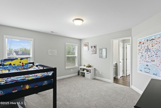 bedroom featuring visible vents, baseboards, and carpet flooring