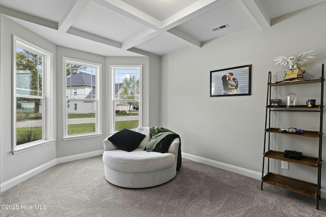 sitting room with beamed ceiling, baseboards, visible vents, and carpet floors