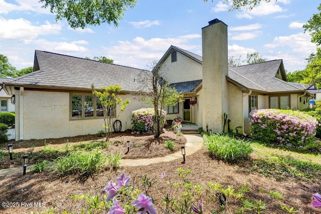 1957 Prestwick Ln, Wilmington, NC 28405 - view of front of property with stucco siding and a chimney