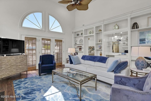 1957 Prestwick Ln, Wilmington, NC 28405 - living area with wood finished floors, a ceiling fan, french doors, and a high ceiling