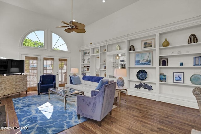 1957 Prestwick Ln, Wilmington, NC 28405 - living room featuring high vaulted ceiling, ceiling fan, wood finished floors, and french doors