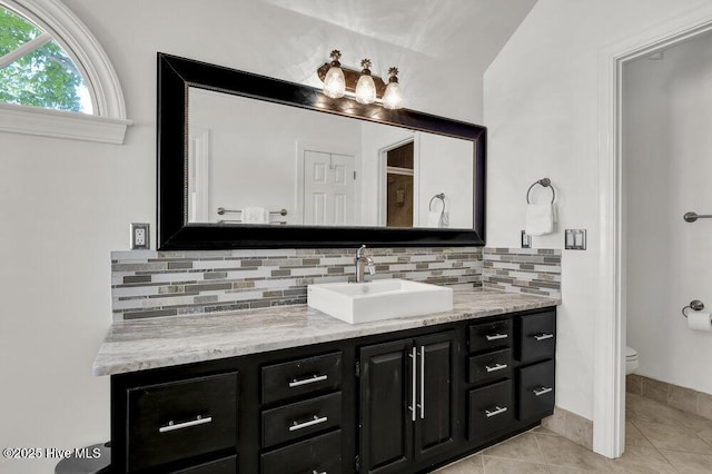 1957 Prestwick Ln, Wilmington, NC 28405 - full bathroom with vanity, backsplash, toilet, and tile patterned flooring
