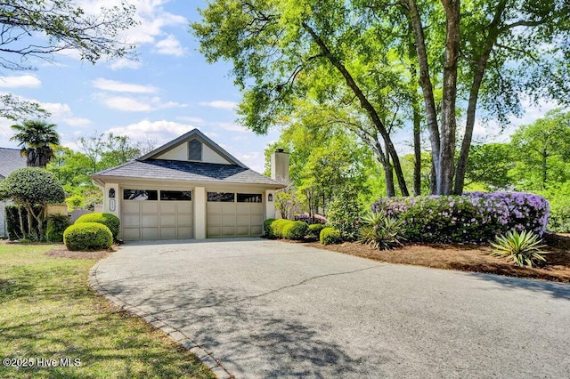 1957 Prestwick Ln, Wilmington, NC 28405 - view of front of property with asphalt driveway, a chimney, an attached garage, and stucco siding