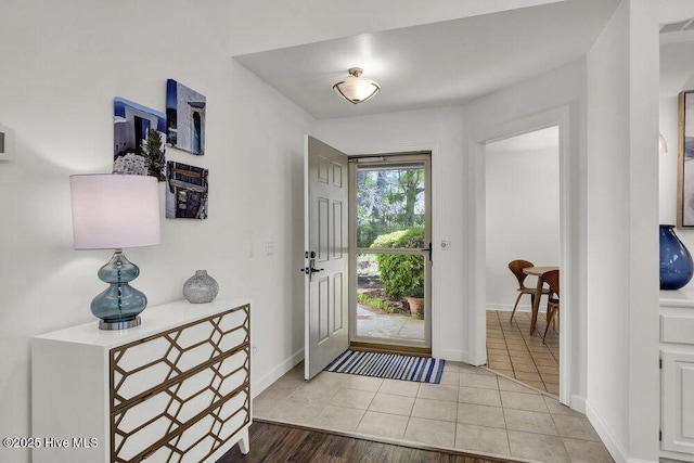 1957 Prestwick Ln, Wilmington, NC 28405 - entryway with baseboards and light tile patterned flooring