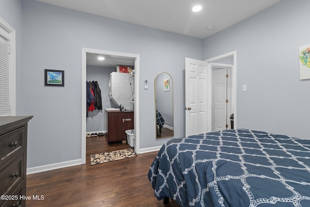 bedroom featuring a closet, baseboards, a walk in closet, and wood finished floors
