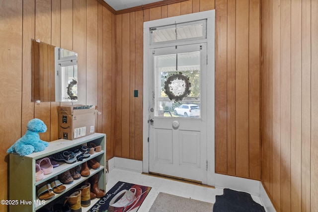 doorway featuring wood walls