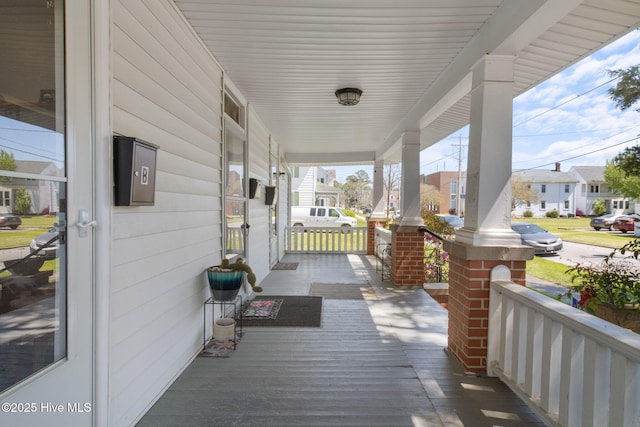 view of patio / terrace with a porch and a residential view