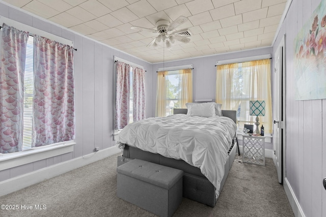 bedroom featuring ceiling fan, carpet flooring, and baseboards
