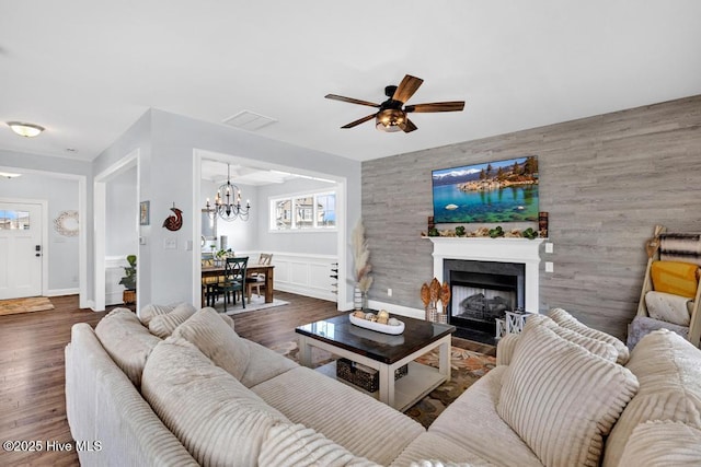 41 S Lamplighters Walk, Hampstead, NC 28443 - living area with a chandelier, ceiling fan, a fireplace with flush hearth, and healthy amount of natural light