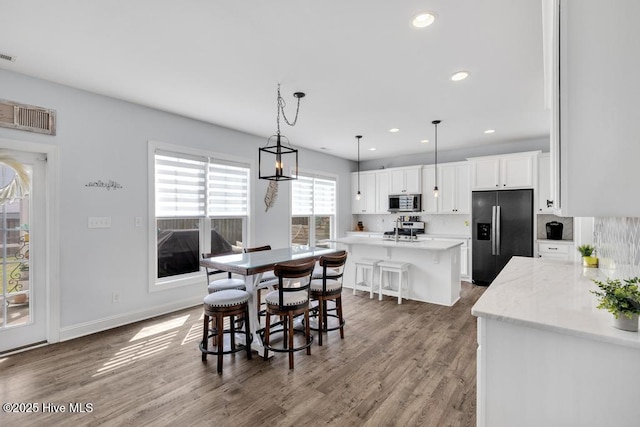 41 S Lamplighters Walk, Hampstead, NC 28443 - dining area with wood finished floors, recessed lighting, and baseboards