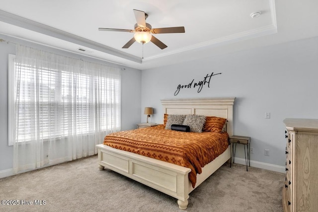 41 S Lamplighters Walk, Hampstead, NC 28443 - bedroom with a tray ceiling, light colored carpet, baseboards, ceiling fan, and ornamental molding